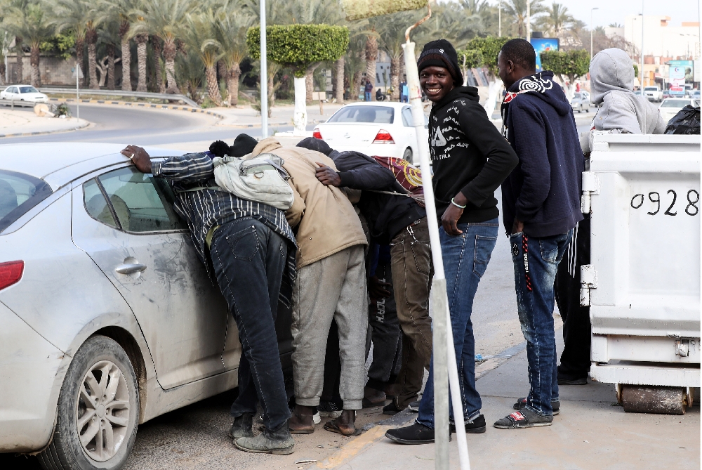 Migrants scrape by in Libya limbo, Europe hopes on hold