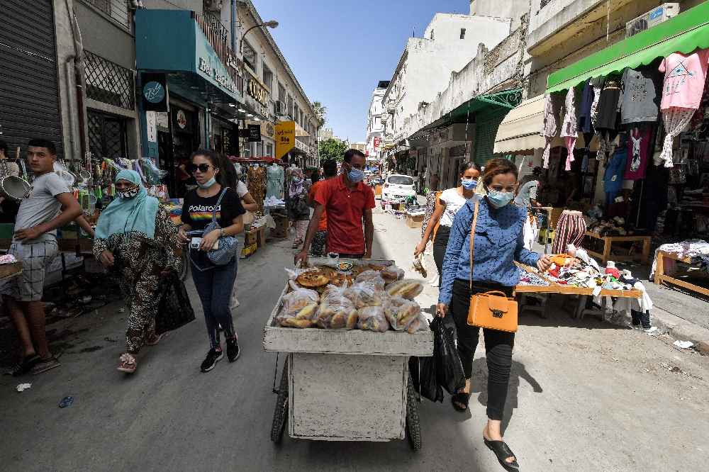 In Tunis cafes, cynicism saps opposition to president's power grab